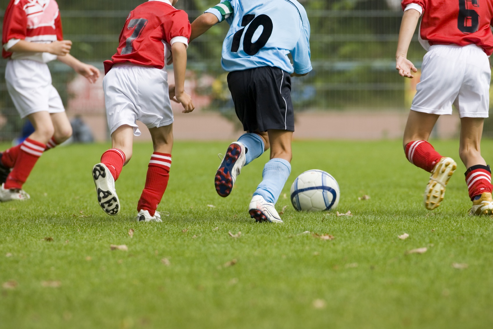 Detail of a soccer game with four players in action